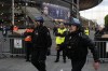 FILE - Police officers guard the Stade de France prior the Champions League final soccer match between Liverpool and Real Madrid, in Saint Denis near Paris, Saturday, May 28, 2022. UEFA-appointed investigators have held European soccer's ruling body mostly responsible for chaotic security failures at the Champions League final in Paris that put the lives of Liverpool and Real Madrid fans at risk, the investigation panel wrote in a 220-page document published Monday, Feb. 13, 2023. (AP Photo/Christophe Ena, File)