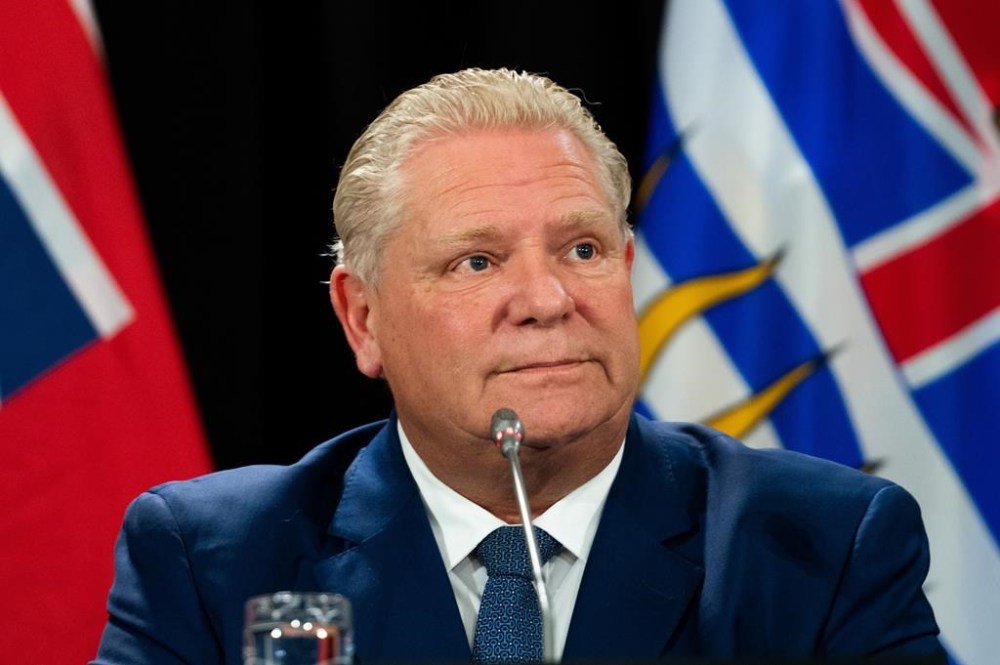 Ontario Premier Doug Ford listens to members of the media during a press conference in Ottawa, on Tuesday, Feb. 7, 2023. Ford believes the federal government will accept his recommendations on sustainability of a new health-care deal.THE CANADIAN PRESS/Spencer Colby