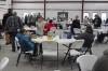People gather at the Norfolk Southern Railways Assistance Center Thursday, Feb. 9, 2013, at the Abundant Life Fellowship in East Palestine, Ohio. Cleanup continues of a Norfolk Southern freight train derailment that derailed Friday night in East Palestine, Ohio. (AP Photo/Gene J. Puskar)