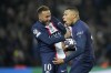 PSG's Kylian Mbappe, right, celebrates with PSG's Neymar after scores a disallowed goal during the Champions League round of 16 first leg soccer match between Paris Saint Germain and Bayern Munich, at the Parc des Princes stadium, in Paris, France, Tuesday, Feb. 14, 2023. (AP Photo/Christophe Ena)