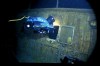 In this image provided by the Woods Hole Oceanographic Institution, an underwater remote vehicle examines an open window of the Titanic 12,500 feet (3.8 kilometers) below the surface of the ocean, 400 miles (640 kilometers) off the coast of Newfoundland, Canada in 1986. Rare and in some cases never before publicly seen video of the dive is being released on Wednesday, Feb. 15, 2023, by the Woods Hole Oceanographic Institution. (Woods Hole Oceanographic Institution via AP)