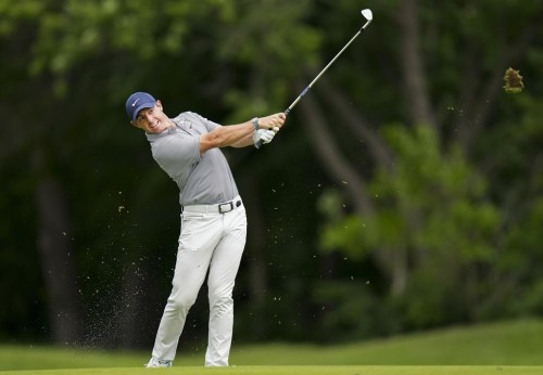 Rory McIlroy of Northern Ireland hits his approach shot on the 18th hole during round three of the Canadian Open at St. George's Golf and Country Club in Toronto on Saturday, June 11, 2022. Viewers can now watch the drama unfold as 
