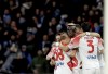 Napoli's Victor Osimhen, center, celebrates after scoring his team's second goal, during the Serie A soccer match between Napoli and Cremonese at the Diego Armando Maradona stadium in Naples, Italy, Sunday, Feb. 12, 2023. (Alessandro Garofalo/LaPresse via AP)