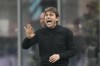 Tottenham's head coach Antonio Conte shouts out as gives instructions from the side line during the Champions League, round of 16, first leg soccer match between AC Milan and Tottenham Hotspur at the San Siro stadium in Milan , Italy, Tuesday, Feb. 14, 2023. (AP Photo/Luca Bruno)