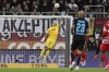 Goalkeeper Rafal Gikiewicz of FC Augsburg stretches for the ball during the Bundesliga soccer match between FC Augsburg and TSG 1899 Hoffenheim at the WWK Arena in Augsburg, Germany, Friday Feb. 17, 2023. (Christian Kolbert/dpa via AP)