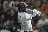 FILE - Chicago White Sox's Luis Robert bats against the Houston Astros during the third inning of a baseball game on June 19, 2022, in Houston. In the aftermath of another year derailed by injuries, the Chicago White Sox center fielder has changed his offseason routine, including going by Luis Robert Jr. now after a discussion with his father. (AP Photo/David J. Phillip, File)