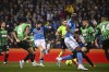 Napoli's Khvicha Kvaratskhelia, third from left, kicks the ball to score to 0-1 during the Serie A soccer match between Sassuolo and Napoli, at the Mapei Stadium in Reggio Emilia, Italy, Friday Feb. 17, 2023. (Massimo Paolone/LaPresse via AP)