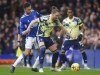 Everton's Dwight McNeil, left, and Leeds United's Luke Ayling battle for the ball during the English Premier League soccer match between Everton and Leeds United at Goodison Park, Liverpool, England, Saturday Feb. 18, 2023. (Peter Byrne/PA via AP)/PA via AP)