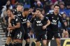 Fulham's Manor Solomon, second right, celebrates scoring against Brighton and Hove Albion during the English Premier League soccer match at the American Express Community Stadium, Brighton, England, Saturday Feb. 18, 2023. (Andrew Matthews/PA via AP)