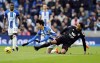 Brighton and Hove Albion's Kaoru Mitoma and Fulham's Kenny Tete battle for the ball during the English Premier League soccer match at the American Express Community Stadium, Brighton, England, Saturday Feb. 18, 2023. (Andrew Matthews/PA via AP)
