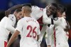 Southampton players celebrate after the English Premier League soccer match between Chelsea and Southampton at the Stamford Bridge stadium in London, Saturday, Feb. 18, 2023. (AP Photo/Kirsty Wigglesworth)