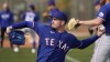 Texas Rangers pitcher Andrew Heaney throws during spring training baseball practice Friday, Feb. 17, 2023, in Surprise, Ariz. (AP Photo/Charlie Riedel)