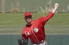 FILE -Cincinnati Reds relief pitcher Justin Wilson throws during the fourth inning of a spring training baseball game against the Kansas City Royals Thursday, March 24, 2022, in Surprise, Ariz. The Milwaukee Brewers have signed left-handed pitcher Justin Wilson to a one-year contract with a club option for 2024 and placed right-hander Jason Alexander on the 60-day injured list, Saturday, Feb. 18, 2023.(AP Photo/Charlie Riedel, File)