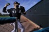 Chicago White Sox starting pitcher Lucas Giolito (27) warms up during an MLB spring training baseball practice, Saturday, Feb. 18, 2023, in Phoenix. (AP Photo/Matt York)