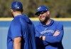 Toronto Blue Jays manager John Schneider, right, laughs with starting pitcher Alek Manoah during baseball spring training in Dunedin, Fla., on Thursday, February 16, 2023. THE CANADIAN PRESS/Nathan Denette