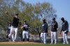 New York Yankees pitcher Gerrit Cole throws to first during a spring training baseball workout Saturday, Feb. 18, 2023, in Tampa, Fla. (AP Photo/David J. Phillip)