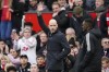 Manchester United's head coach Erik ten Hag waves during the English Premier League soccer match between Manchester United and Leicester City at the Stamford Bridge stadium in Manchester, England, Sunday, Feb. 19, 2023. (AP Photo/Dave Thompson)