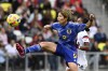 Japan forward Riko Ueki (9) kicks the ball away from U.S. defender Naomi Girma during the first half of a SheBelieves Cup soccer match Sunday, Feb. 19, 2023, in Nashville, Tenn. (AP Photo/Mark Zaleski)