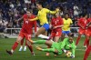 Canada goalkeeper Kailen Sheridan (1) grabs the ball as she stops a shot by Brazil during the first half of a SheBelieves Cup women's soccer match Sunday, Feb. 19, 2023, in Nashville, Tenn. Brazil defender Kathellen (3) leaps over Sheridan. THE CANADIAN PRESS/AP-Mark Zaleski