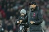 Liverpool's manager Jurgen Klopp walks on the field after the English Premier League soccer match between Liverpool and Everton at the Anfield stadium in Liverpool, England, Monday, Feb. 13, 2023. (AP Photo/Jon Super)