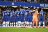 Chelsea players observe a moment of silence for Christian Atsu who died in Turkey earthquake before the English Premier League soccer match between Chelsea and Southampton at the Stamford Bridge stadium in London, Saturday, Feb. 18, 2023. (AP Photo/Kirsty Wigglesworth)