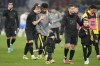 Dortmund's Julian Ryerson, second left, embraces teammate Karim Adeyemi as they celebrate after their win in the German Bundesliga soccer match against Hertha BSC Berlin in Dortmund, Germany, Sunday, Feb. 19, 2023. (AP Photo/Martin Meissner)