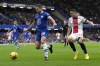 Chelsea's Cesar Azpilicueta, left, is challenged by Southampton's Mohamed Elyounoussi during the English Premier League soccer match between Chelsea and Southampton at the Stamford Bridge stadium in London, Saturday, Feb. 18, 2023. (AP Photo/Kirsty Wigglesworth)