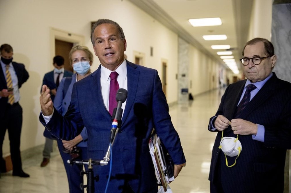 FILE — Rep. David Cicilline, D-R.I., center, accompanied by Rep. Madeleine Dean, D-Pa., left, and Chairman Rep. Jerrold Nadler, D-N.Y., right, speaks to members of the media following a House Judiciary Committee closed door meeting with former federal prosecutor for the Southern District of New York Geoffrey Berman on Capitol Hill, Thursday, July 9, 2020, in Washington. Cicilline said Tuesday, Feb. 21, 2023 that he will step down from his congressional seat this summer to lead the Rhode Island Foundation, his home state's largest funder of nonprofits. (AP Photo/Andrew Harnik, File)