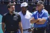 FILE - Yasir Al-Rumayyan, left, governor of Saudi Arabia's Public Investment Fund, Majed Al-Sorour, CEO of Golf Saudi, center, and Greg Norman, CEO of LIV Golf, watch at the first tee during the second round of the Bedminster Invitational LIV Golf tournament in Bedminster, N.J., on July 30, 2022. A federal judge has ruled the head of Saudi Arabia's sovereign wealth fund, the financial backer of LIV Golf, must sit for depositions and produce documents in LIV Golf's antitrust lawsuit against the PGA Tour. Lawyers for the Public Investment Fund and its governor, Yasir al-Rumayyan, had sought to quash subpoenas claiming sovereign immunity. (AP Photo/Seth Wenig, File)