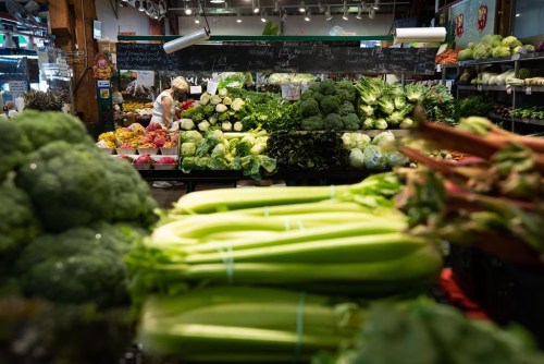 A woman shops for produce at the Granville Island Market in Vancouver, on Wednesday, July 20, 2022. Statistics Canada said Tuesday that grocery prices were up 11.4 per cent from a year ago and 11 per cent from December, even as the country's annual inflation rate slowed to 5.9 per cent in January. THE CANADIAN PRESS/Darryl Dyck
