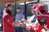 Philadelphia Phillies' Brandon Marsh signs autographs during a spring training baseball workout Tuesday, Feb. 21, 2023, in Clearwater, Fla. (AP Photo/David J. Phillip)