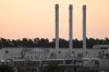 FILE - The sun rises behind the landfall facility of the Nord Stream 1 Baltic Sea pipeline and the transfer station of the OPAL gas pipeline, the Baltic Sea Pipeline Link, in Lubmin, Germany, July 21, 2022. Russia clashed with the United States and other Western nations Tuesday, Feb. 21, 2023 over the Kremlin’s call for a U.N. investigation of last September’s sabotage of the Nord Stream 1 and 2 gas pipelines from Russia to Western Europe. (AP Photo/Markus Schreiber, File)