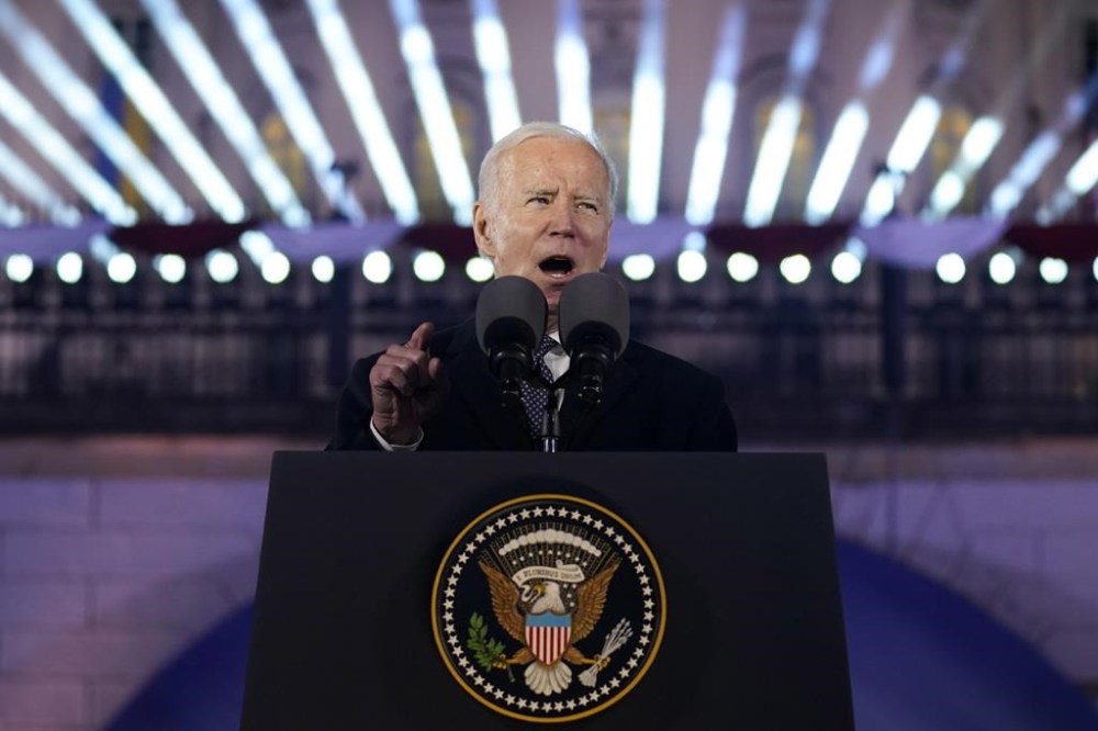 President Joe Biden delivers a speech marking the one-year anniversary of the Russian invasion of Ukraine, Tuesday, Feb. 21, 2023, at the Royal Castle Gardens in Warsaw. (AP Photo/ Evan Vucci)