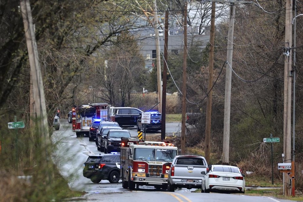 Emergency vehicles appear near the location where a small aircraft crashed while taking off from the Bill and Hillary Clinton National Airport in Little Rock, Ark., Wednesday Feb. 22, 2023. (Staton Breidenthal/Arkansas Democrat-Gazette via AP)