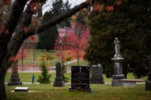 A man walks through Mountain View Cemetery in Vancouver, on Wednesday October 23, 2019. THE CANADIAN PRESS/Darryl Dyck