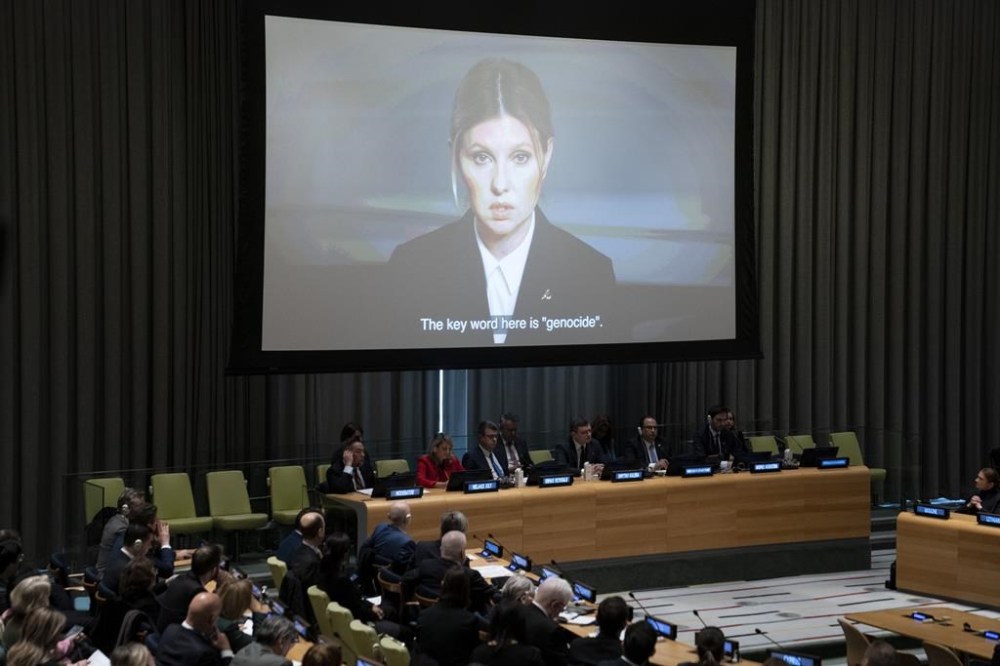 First Lady of Ukraine Olena Zelenska addresses attendees via video during a meeting on the