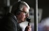 FILE - Britain's football commentator John Motson follows a match, May 13, 2018. Motson has died at the age of 77. He was one of the most well-known voices in British sport for 50 years. The BBC announced the death of Motson on Thursday, Feb. 23, 2023 without giving any details. Motson was fondly known as “Motty.” He called games for Britain’s national broadcaster from 1968-2018. He covered 10 World Cups, 10 European Championships and 29 FA Cup finals during that time. (Dominic Lipinski/PA via AP, File)