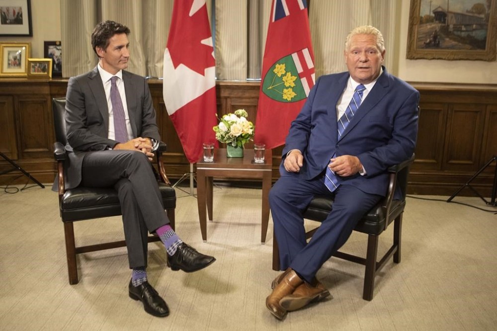 Prime Minister Justin Trudeau (left) meets Ontario Premier Doug Ford, at the Queens Park Legislature in Toronto on Tuesday, August 30, 2022. The federal government says it has reached an agreement in principle with Ontario on health care. THE CANADIAN PRESS/Chris Young