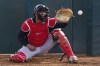 Cleveland Guardians catcher Bo Naylor reaches out to catch a pitch during the first day of spring training baseball workouts for Guardians pitchers and catchers in Goodyear, Ariz., Friday, Feb. 17, 2023. (AP Photo/Ross D. Franklin)