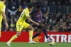Barcelona's Ansu Fati, right, and Cadiz's Luis Hernandez challenge for the ball during the Spanish La Liga soccer match between Barcelona and Cadiz CF at the Camp Nou stadium in Barcelona, Spain, Sunday, Feb. 19, 2023. (AP Photo/Joan Monfort)