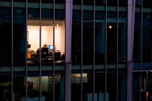 While salary negotiations are a normal part of the hiring process, experts say it's a stone often left unturned by young candidates unsure of how to ask for more money from an employer. A worker sits in an office in the financial district in London, Monday, Dec. 13, 2021. THE CANADIAN PRESS/AP-Alberto Pezzali