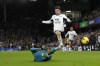 Fulham's Manor Solomon, right, and Wolverhampton Wanderers' Nelson Semedo fight for the ball during the English Premier League soccer match between Fulham and Wolverhampton Wanderers at Craven Cottage stadium in London, Friday, Feb. 24, 2023. (AP Photo/Kirsty Wigglesworth)