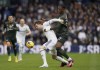 Leeds United's Patrick Bamford and Southampton's Armel Bella-Kotcha, right, battle for the ball during the English Premier League soccer match between Leeds United and Southampton at Elland Road, Leeds, England, Saturday Feb. 25, 2023. (Tim Goode/PA via AP)