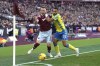 West Ham United's Vladimir Coufal, left and Nottingham Forest's Renan Lodi battle for the ball during the English Premier League soccer match between West Ham United and Nottingham Forest at the London Stadium, in London, Saturday, Feb. 25, 2023. (Gareth Fuller/PA via AP)
