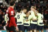 Manchester City's Julian Alvarez celebrates with teammates after scoring his side's fourth goal during the English Premier League soccer match between Bournemouth and Manchester City at the Vitality Stadium in Bournemouth, England, Saturday, Feb. 25, 2023. (AP Photo/David Cliff)