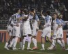 Napoli's Victor Osimhen, center left, celebrates scoring with teammates during the Serie A soccer match between Empoli and Napoli at Castellani Stadium in Empoli, Italy, Saturday Feb. 25, 2023. (Marco Bucco/LaPresse via AP)