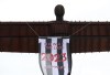 A view of the Angel of the North, with a message attached, ahead of the EFL Cup soccer match between Newcastle United and Manchester United played at Wembley on Sunday, in Gateshead, England, Saturday, Feb. 25, 2023. (AP Photo/Scott Heppell)