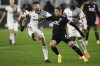 Toronto FC midfielder Jonathan Osorio, left, and D.C. United midfielder Russell Canouse (6) battle for the ball during the first half of an MLS soccer match, Saturday, Feb. 25, 2023, in Washington. (AP Photo/Nick Wass)
