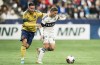 Real Salt Lake's Bryan Oviedo (left) grabs a hold of Vancouver Whitecaps FC's Ryan Gauld during first half MLS soccer action in Vancouver, B.C., Saturday, February 25, 2023. THE CANADIAN PRESS/Rich Lam