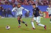 FC Dallas forward Jesús Ferreira, left, dribbles the ball past Minnesota United defender Miguel Tapias during the second half of an MLS soccer match in Frisco, Texas, Saturday, Feb. 25, 2023. (AP Photo/Gareth Patterson)
